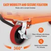 Close-up of the wheels and braking mechanism of an orange industrial cart. Anteprima dell’immagine prodotto