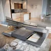 A modern living room with a large sectional sofa, kitchen island, and dining area. Produktbild-Vorschau