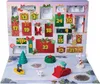 A Christmas advent calendar with PAW Patrol characters and accessories displayed on a snowy scene. Podgląd zdjęcia produktu