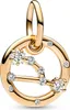 A close-up studio shot of a gold-colored charm with clear stones, shaped like a constellation. Voir les images du produit