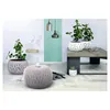 A modern living room setting with plants and decorative items. Náhľad obrázku produktu