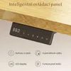 A close-up of a black control panel for a standing desk, mounted under a wooden surface. The panel has a digital display and several buttons with icons and numbers. Below the panel, there are four circular icons with accompanying text describing features l Náhled obrázku produktu