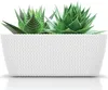 A white planter with a textured knit pattern containing two green succulent plants. Anteprima dell’immagine prodotto