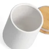 A close-up view of a white ceramic jar with a wooden lid. Produktbild-Vorschau