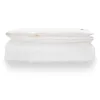 A white duvet is folded and stacked on top of another white duvet, both against a white background. Produktbild-Vorschau