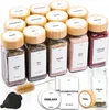 A collection of spice jars with bamboo lids and labels, along with accessories like a brush and funnel, arranged on a white background. Náhled obrázku produktu
