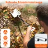 A person is using a snow shovel to clear leaves from the ground. Produktbild-Vorschau