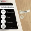 A door handle set with its included accessories displayed on a wooden door. Produktbild-Vorschau