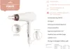 A white and rose gold hair dryer with informational text and diagrams. Náhled obrázku produktu
