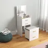 A white vanity table with a mirror and a stool in a room with light gray walls and a wooden floor. Produktbild-Vorschau