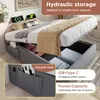 A bed with hydraulic storage, showing the storage compartments and charging ports. Voir les images du produit