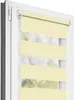 A close-up view of a light yellow dual roller blind installed on a white window frame. Produktbild-Vorschau