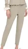 A person wearing beige pants and a beige jacket with cream-colored cuffs. Produktbild-Vorschau