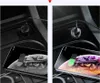 Two images showing a car charger plugged into a car's power outlet, with a smartphone charging wirelessly on top of the charger. Produktbild-Vorschau