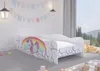A child's bed with a unicorn and rainbow design in a bedroom. Náhled obrázku produktu