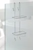A chrome shower caddy with two baskets hangs on a glass shower door. Produktbild-Vorschau