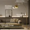 A modern living room with a sofa and a floor lamp. Produktbild-Vorschau