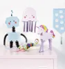 A collection of craft toys displayed on a pink surface against a white background. Voir les images du produit