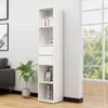 A white bookshelf is shown in a room with a sofa and a plant, next to a large window. Produktbild-Vorschau