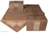 Two brown table runners with cut-out patterns are displayed on a white background. Produktbild-Vorschau