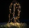 A solar-powered garden light with cascading LED lights at night. Anteprima dell’immagine prodotto
