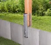 A wooden post is mounted to a concrete wall using a metal bracket. Anteprima dell’immagine prodotto