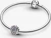 A close-up studio shot of a Pandora bracelet with a charm. Produktbild-Vorschau