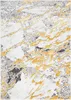 A close-up view of a rug with a marble-like pattern in gray and gold. Produktbild-Vorschau