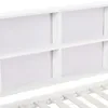 A close-up view of the white headboard of a bed, featuring built-in shelving compartments and the wooden slats of the bed frame below. Náhľad obrázku produktu