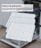 Close-up of white grill plates for a contact grill, with text overlay indicating dishwasher safety. Produktbild-Vorschau
