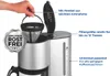 A hand is shown holding a reusable coffee filter over a coffee maker. Produktbild-Vorschau