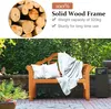 A wooden garden bench with cushions and a blanket is set up outdoors, with greenery in the background. Podgląd zdjęcia produktu