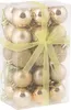 A clear, well-lit studio shot of a box of gold Christmas ornaments. Anteprima dell’immagine prodotto
