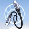 A Ugreen USB-C to USB-C charging cable is shown against a blue and white background with circular light effects. Náhled obrázku produktu