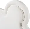 A close-up view of the white upholstered headboard of a bed. Produktbild-Vorschau