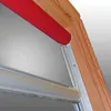 Close-up view of a window roller blind mechanism attached to a wooden frame. Produktbild-Vorschau