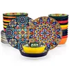 A collection of colorful, patterned plates and bowls. Produktbild-Vorschau