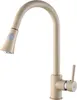 A beige granite-textured kitchen faucet with a pull-out spout and a single lever handle, isolated on a white background. Anteprima dell’immagine prodotto