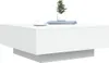 A modern white coffee table with a small potted plant on top. Náhľad obrázku produktu