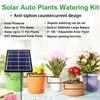 A solar-powered plant watering system is set up with potted plants on a windowsill. Produktbild-Vorschau