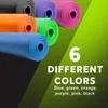 Several rolled-up yoga mats in different colors are displayed, with text overlaying the image. Podgląd zdjęcia produktu