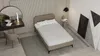 A bedroom scene with a bed, vanity, and decorative elements. Produktbild-Vorschau