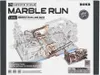 The image shows the packaging of a ROKR 3D wooden puzzle marble run link pack. The packaging features a detailed illustration of the marble run mechanism and includes product information and warnings. Produktbild-Vorschau