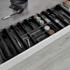 A kitchen drawer filled with organized utensils and kitchen tools. Produktbild-Vorschau