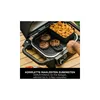 A person is using a grill to cook burgers and curly fries. Anteprima dell’immagine prodotto