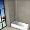 A bathtub with a glass shower screen attached, in a tiled bathroom with a large window overlooking a tropical scene. Produktbild-Vorschau
