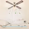 A ceiling fan with four blades is shown above a bed, with an illustration of air circulation and leaf-like particles flowing downwards. Náhľad obrázku produktu
