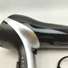 A close-up view of a black and silver hairdryer. Produktbild-Vorschau