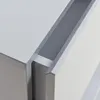 A close-up view of a light gray drawer unit, showing the edge of an open drawer. Produktbild-Vorschau