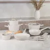 A collection of cookware set on a kitchen counter. Náhled obrázku produktu